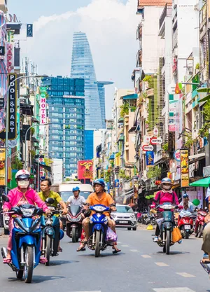 Busy street filled with motorcyclists in Ho Chi Minh City
